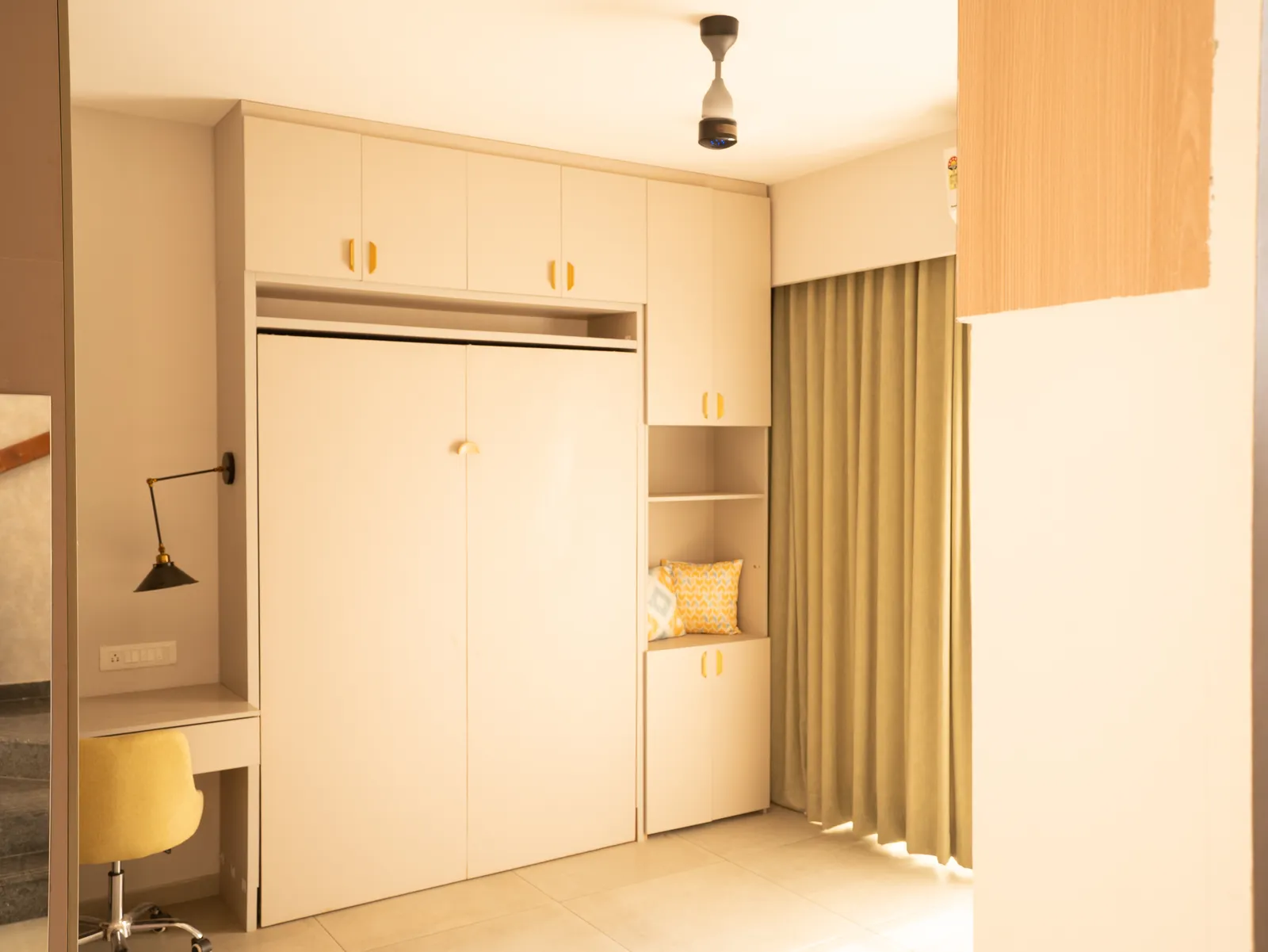 Study room with fold-down wall bed and desk — Amlan's Residence